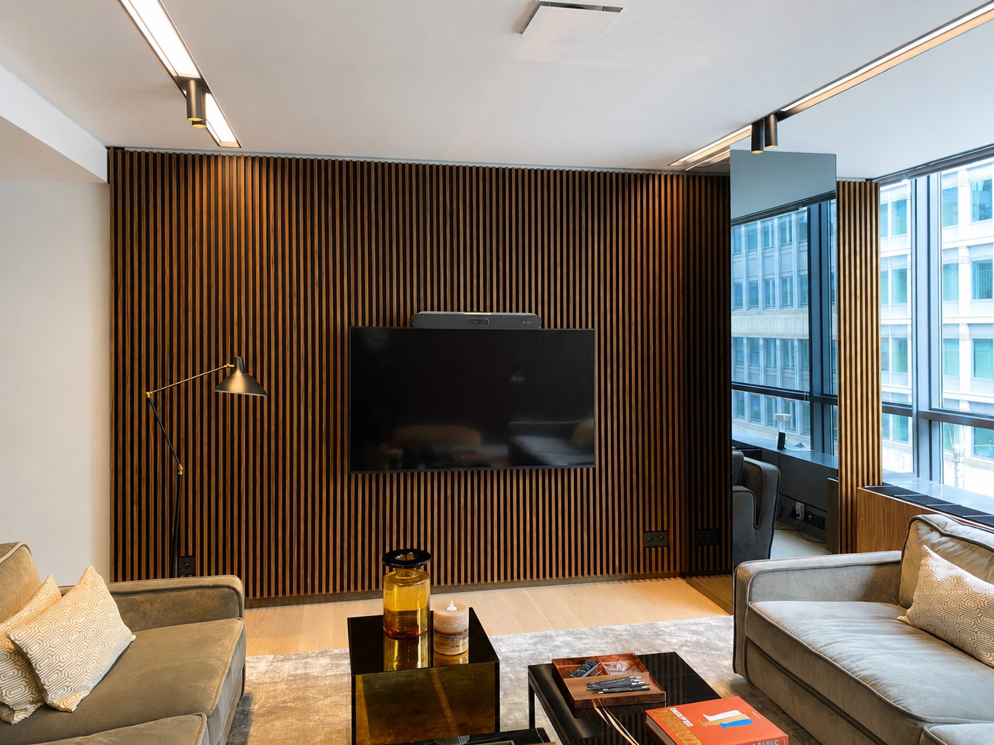 Bespoke timber media wall in a completed interior