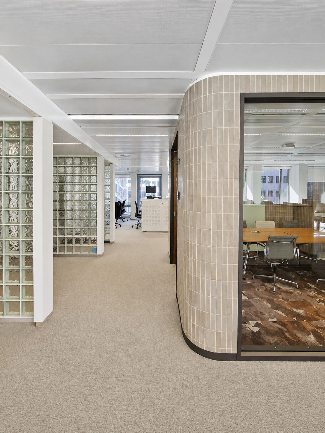 Completed office interior with curved tiles and glass blocks